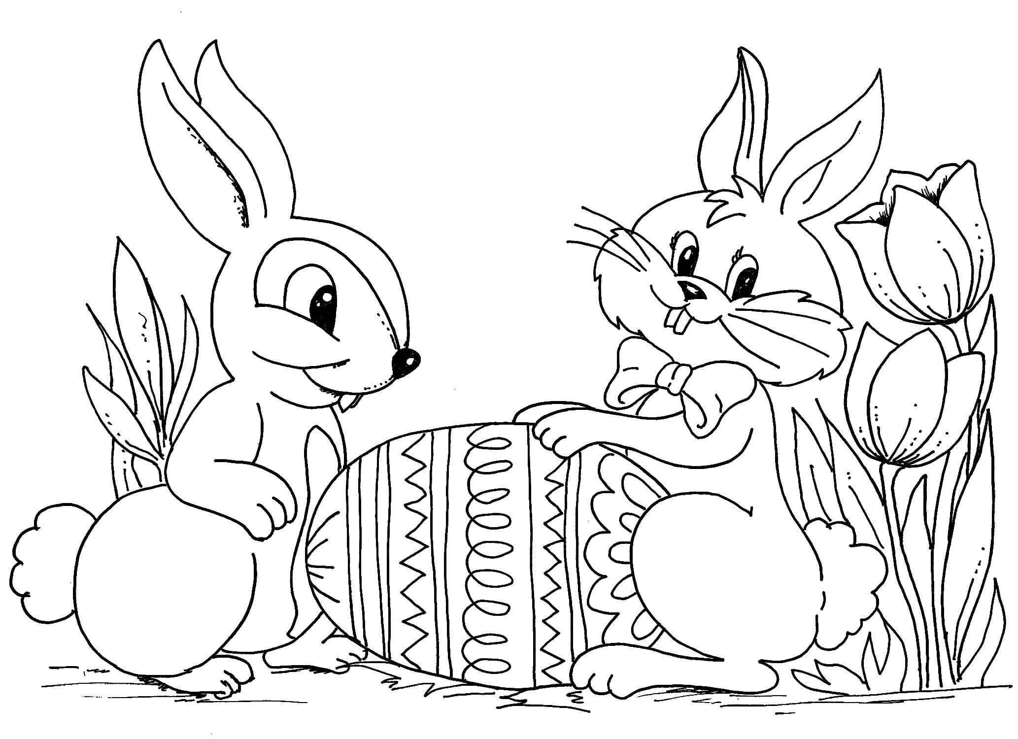 2 conejos con huevo para colorear